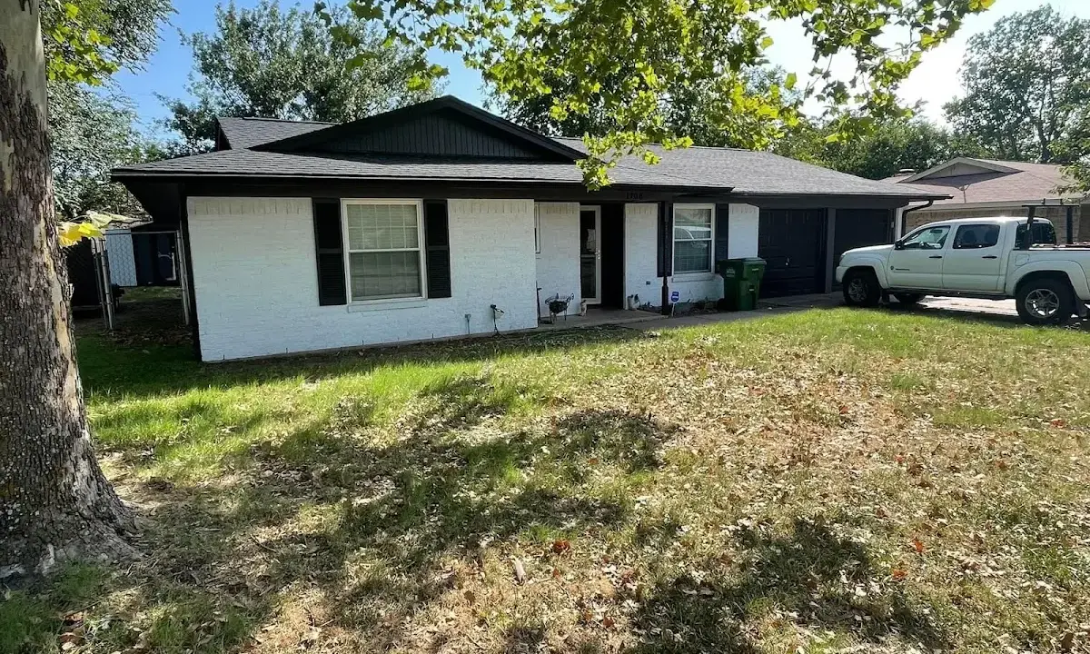Professional roofing crew working on a residential roof in Kahaluu-Keauhou